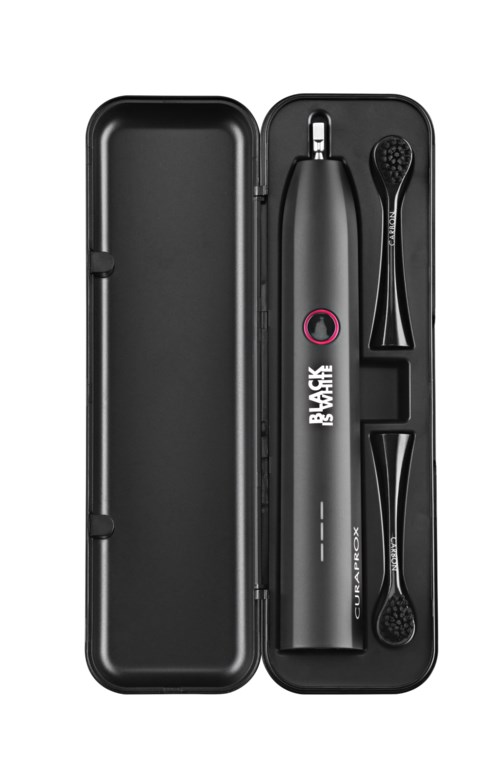 A black electric toothbrush with two replacement brush heads in a hard black case.