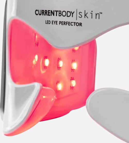 Valkoinen laite, jossa on pinkki osa ja punaisia valoja, merkitty LED-silmähoidoksi ihonhoitoon.