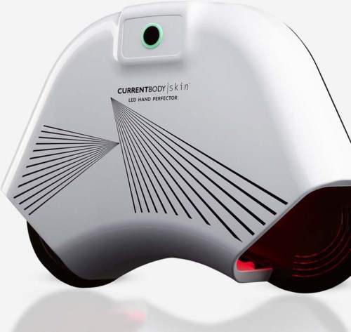 Valkoinen laite, jossa lukee 'CurrentBody Skin LED Hand Perforator', ja yläosassa pieni vihreä ympyrä sekä mustia viivoja.
