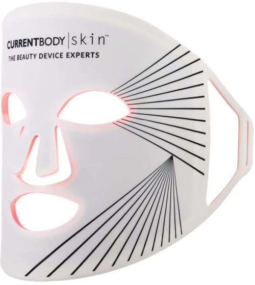 Een wit gezichtsmasker met zwarte lijnen, uitsparingen voor ogen, neus en mond, gemarkeerd 'Currentbody Skin' en 'The beauty device experts.'