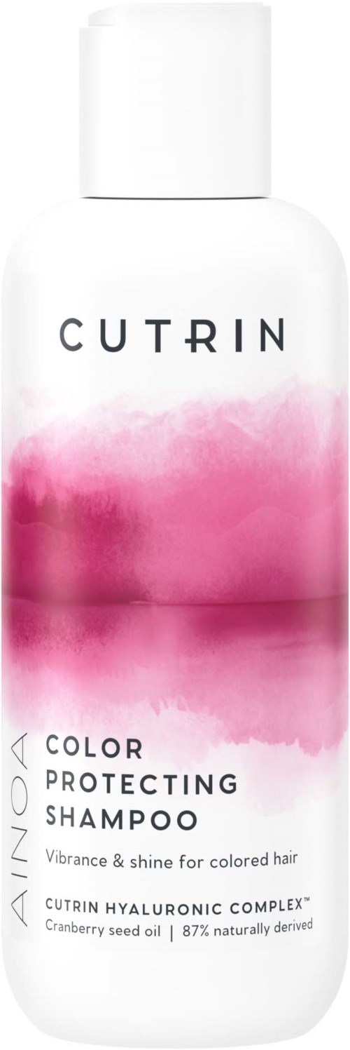 En vit flaska med rosa akvarelldesign, märkt med varumärket 'CUTRIN' och beskriver som färgskyddande schampo.