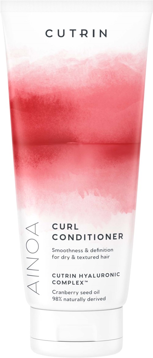 Valkoinen ja punainen purkki merkittynä 'Cutrin Ainoa Curl Conditioner' kuivalle hiukselle, sisältää karpalinsiemenöljyä ja hyaluronihappokompleksin.