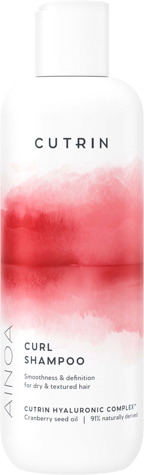 White bottle with pink and red watercolor design, labeled 'CUTRIN CURL SHAMPOO' for textured hair.
