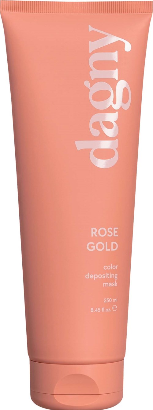 A peach-colored tube of Dagnys Rose Gold color depositing mask with white text.