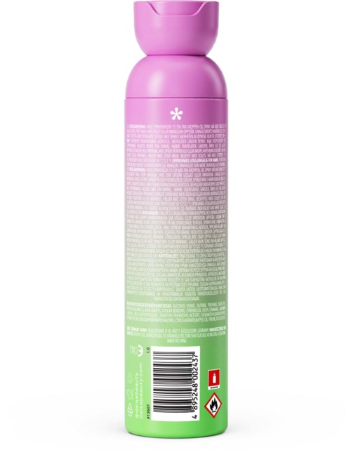 A pink and green bottle with product details in small text and a barcode, likely a skincare or shower product.