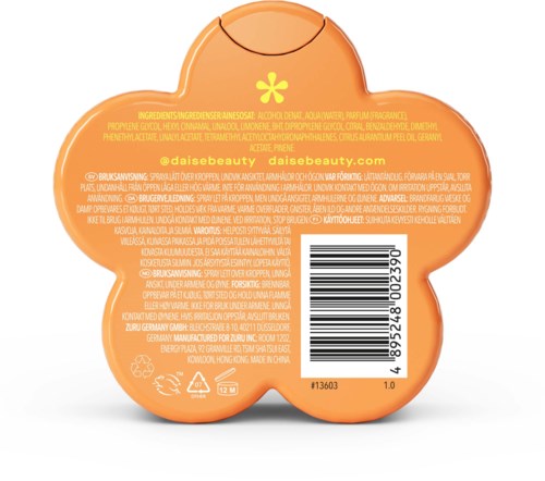 A round orange container with a yellow flower-like shape, showing ingredients, barcode, and website URL.