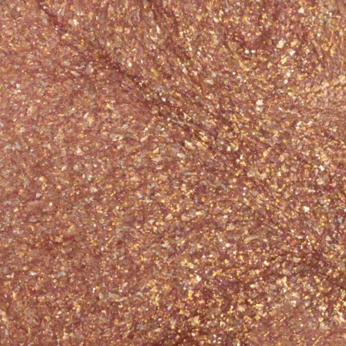 En närbild av en glitterig, gyllene-brun texturerad yta, glänsande och gnistrande överallt.