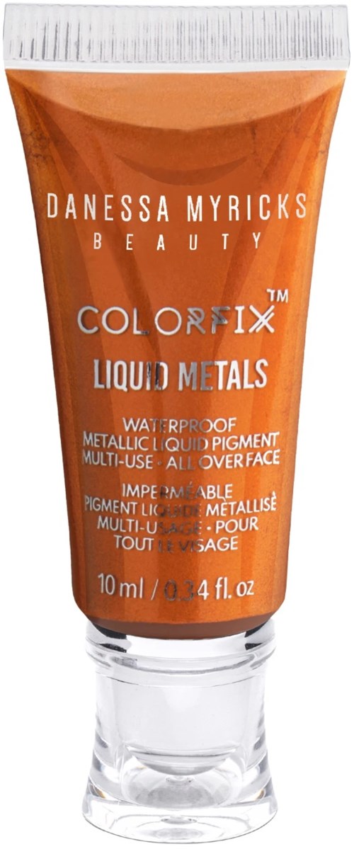 Orange tub med vit lock, etiketten säger 'Danessa Myricks Beauty Color Fix Liquid Metals,' 10 ml.
