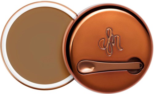 A round container with a lid, showing a tan-colored product inside, and a lid with a logo and handle.