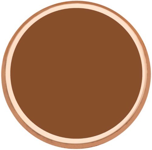 A round wooden container filled with brown material, possibly chocolate or coffee. It has a light border around it.