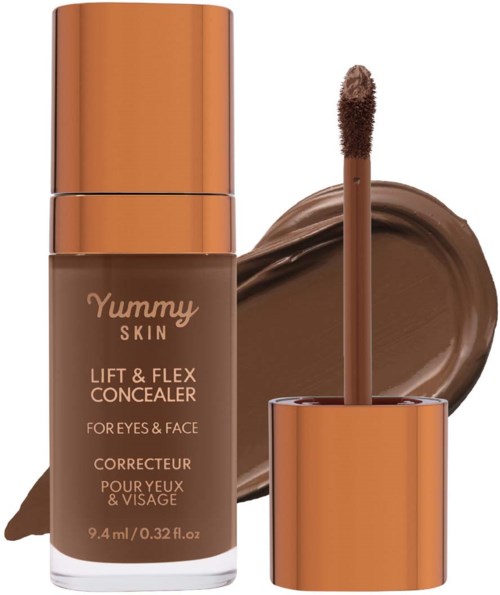 A bottle of Yummy Skin concealer with a wand applicator, surrounded by a swatch of brown concealer.
