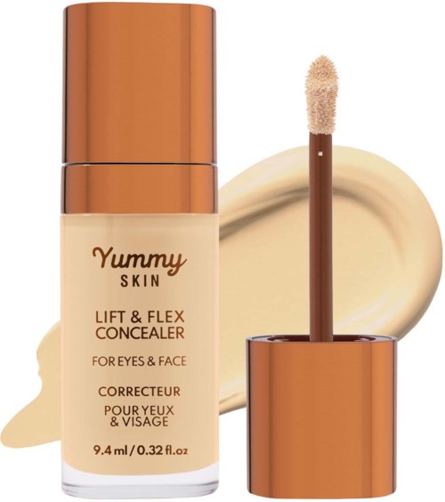 A concealer bottle with a brown cap, applicator, and a beige-colored cream swatch in the background.