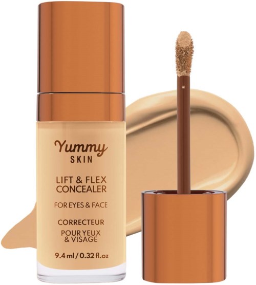 A concealer bottle with applicator and beige cream in background. The bottle is labeled 'Yummy Skin' for eyes and face.
