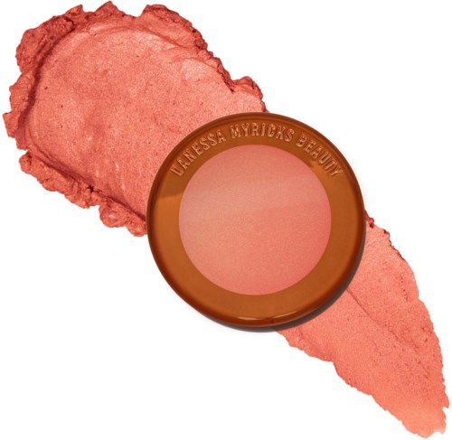 Een blush compact met een roze poedervlek erachter, gemerkt "Unessa Myrica's Beauty."