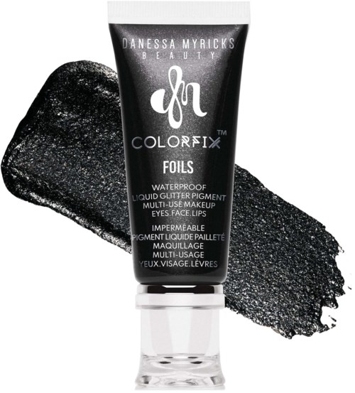 Black waterproof liquid glitter pigment tube with black and silver glitter smudged background.