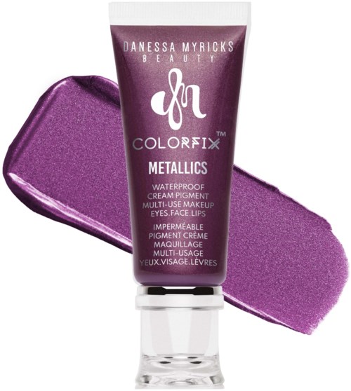 Purple metallic cream pigment in a tube with a swatch of the color behind it.
