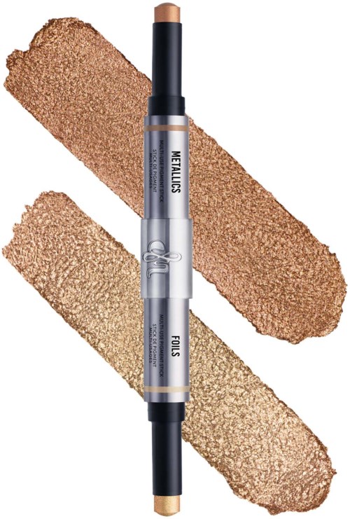 A dual-ended makeup stick with beige and darker shades, labeled "HELLOS" and "FOILS." Smudges of each shade are behind it.