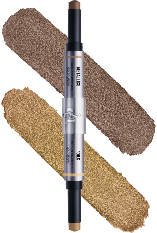 A dual-ended makeup stick with beige and brown shades, and two swatches of makeup, one light and one dark.