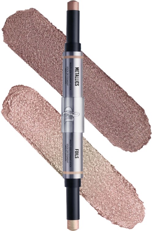 A dual-ended makeup stick with beige shades, swatched on black and white backgrounds for display.