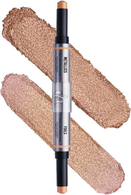 A dual-ended stick with a concealer and highlighter, placed on textured beige and pink backgrounds.