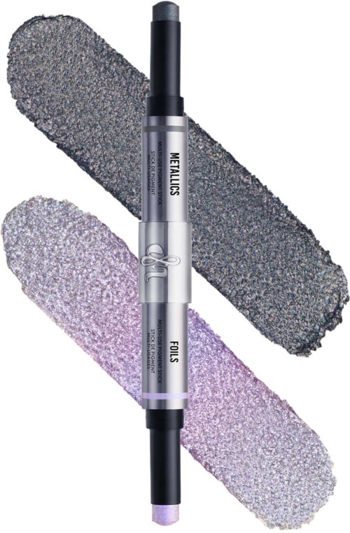A double-ended makeup stick with a black tip and a purple tip, labeled "WELLABS FOCUS." Two textured swipes are behind it.