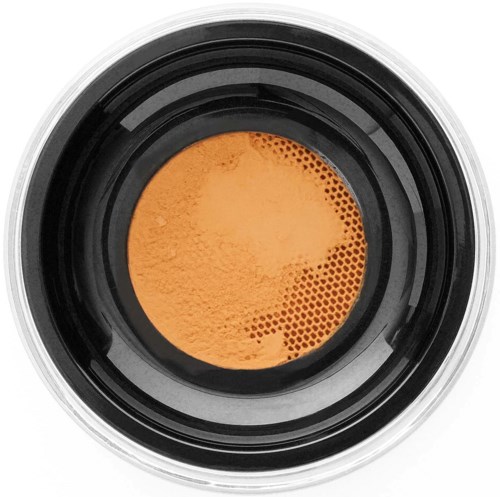 Kosmetiktub med orange puder makeup inuti, sett ovanifrån.