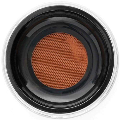 Närbild av en rund orange makeup-svamp med ett strukturerat yta för att blanda smink.