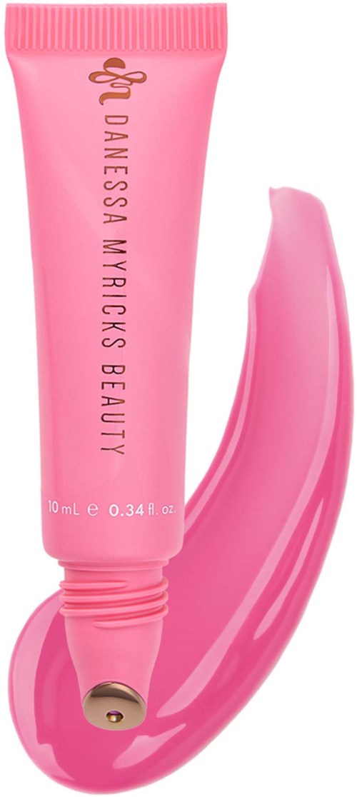 Vaaleanpunainen putki D Anessa Myricks Beauty -tuotetta ja sen vieressä tuotteen levitys.