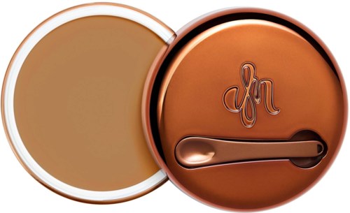 A round container with a lid and a spoon, both in a shiny bronze color, with a logo on the lid.