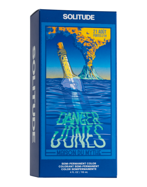 Eine Schachtel mit Design eines Flaschen in Wasser und ausbrechendem Vulkan, mit Text über eine Show und dauerhafte Haarfarbe.
