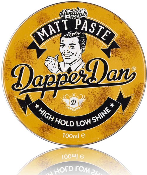 Pyöreä Dapper Dan -logo, jossa vintage-mies, keltainen taustaväri ja teksti hiustuotteen ominaisuuksista.