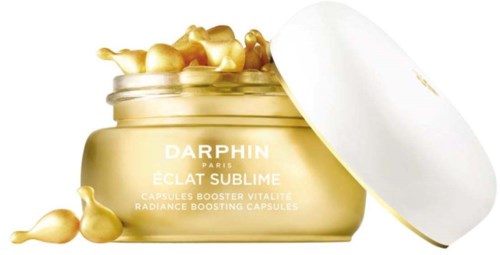Ein goldener Behälter mit Kapseln, beschriftet Darphin Paris Eau Sublime, zur Steigerung der Hautvitalität.