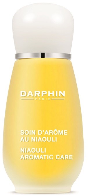 Gelbe Flasche mit weißem Deckel, beschriftet "Soin d'Arôme au Niaouli," für aromatische Pflege.