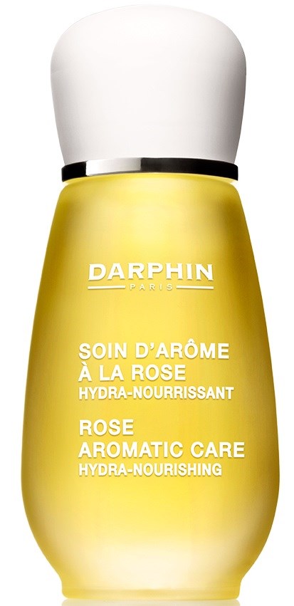 Eine gelbe Flasche mit weißem Deckel, beschriftet als Darphin Rose nährende Feuchtigkeitscreme für strahlende Haut.