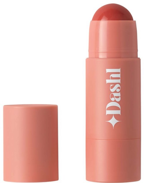 Een roze cilindervormige container met deksel naast een grote stok van een roze vaste stof.