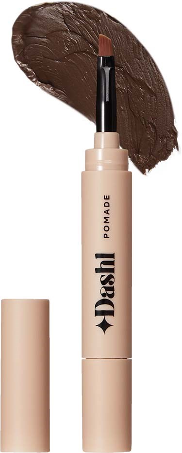 Een beige lippenstiftverpakking met 'Dash' erop en daarboven een bruine lippenstiftvlek.