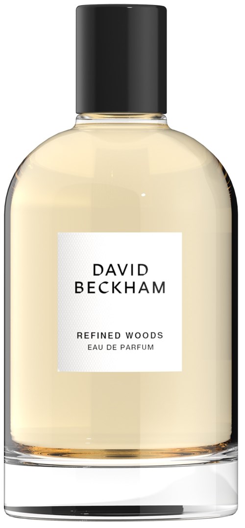 Een glazen parfumfles met zwarte dop, gemerkt David Beckham Refined Woods Eau de Parfum.