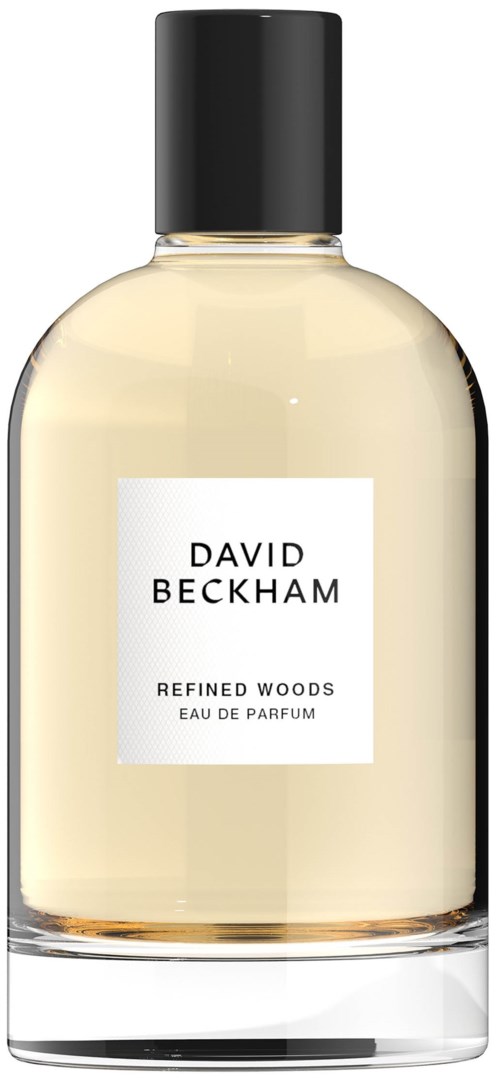 Een doorschijnbare glazen parfumfles met zwarte dop, label "David Beckham Refined Woods".