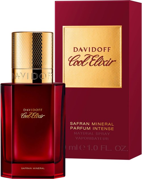 Een rood parfumbotje met gouden dop en label, en een bijpassende rode doos ernaast.