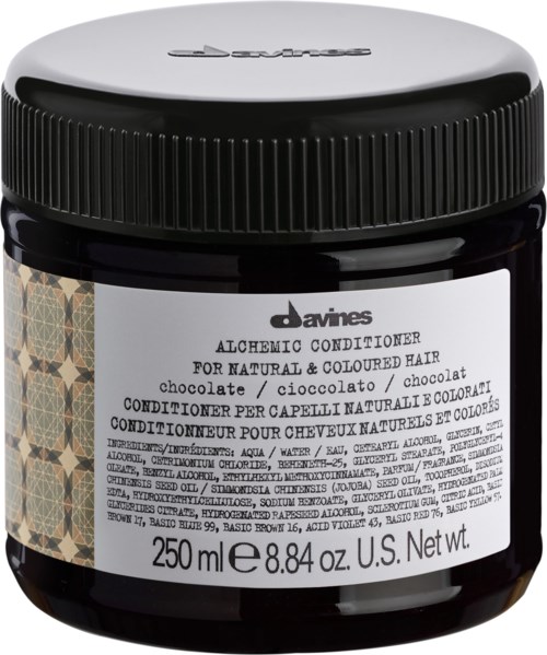 A black jar of Davines Alchemic Conditioner for colored hair, with a white label, cap, and product details.