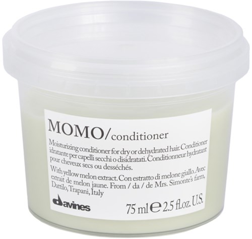 En vit behållare med en etikett för MOMO balsam, innehåller 75 ml, tillverkad av Davines, för torrt hår med melonextrakt.