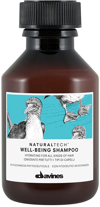En brun flaska med Davines Well-Being Shampoo med fågelillustrationer på etiketten.