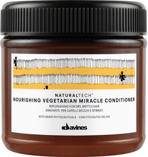 En burk närande vegetarisk balsam för torrt, sprött hår med svart lock och en etikett med gula ränder.