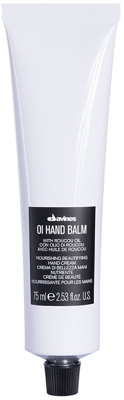 Vitt tub med Davines oil hand balm med svart etikett, 75 ml. Närande hudvårdsprodukt.