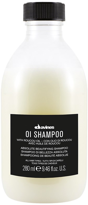 Vit flaska med Savines OI Schampo med svart lock, svart och vit etikett, innehåller 280 ml hårtvätt.