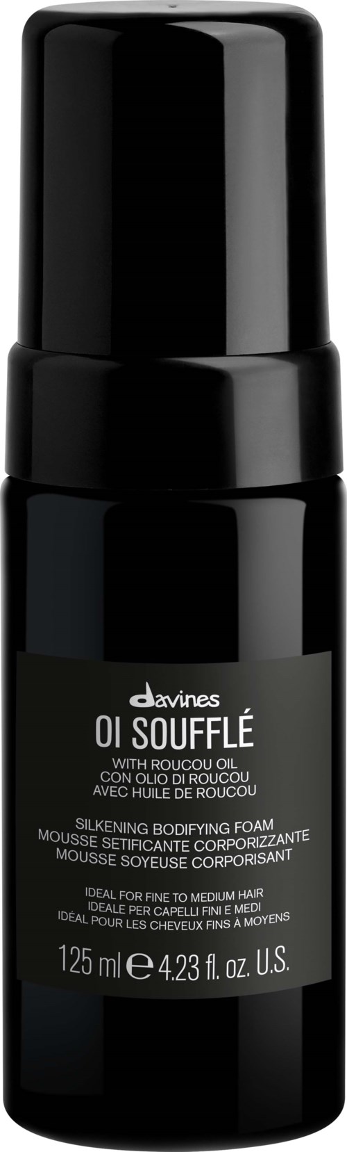 En svart flaska med Davines Oi Soufflé med pump, utformad för att forma och näring av hår.