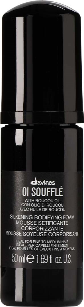 A black cylindrical bottle with a pump, labeled 'Davines Oil Souffle', for hair care, 50ml capacity.