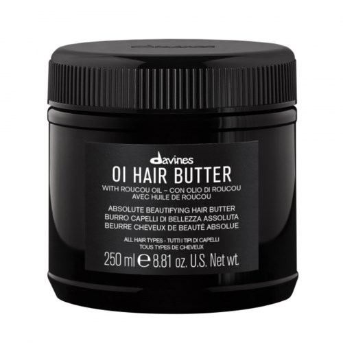 En svart burk av Davines OI Hair Butter med skruvlock, etikett i vitt, innehåller hårvårdsprodukt.