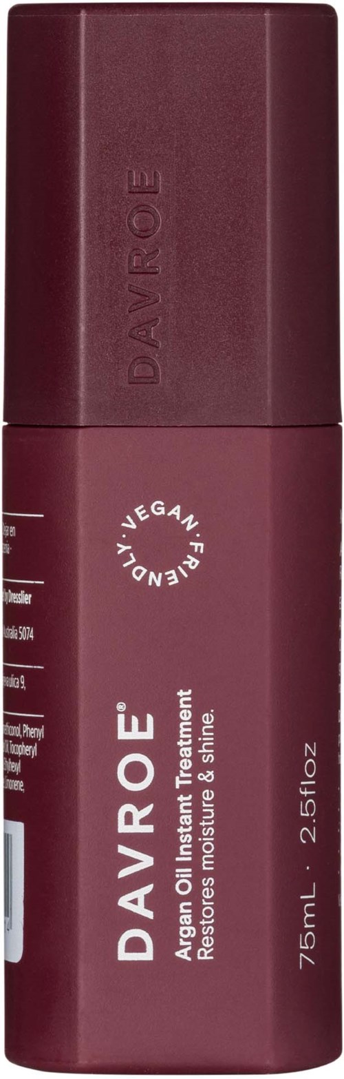 Tummansininen Davroé arganöljynhoitopullo, 75 ml, korkilla ja tuotenäytöllä.