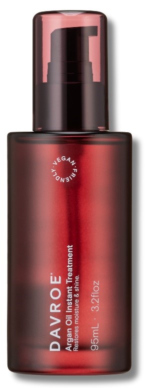 A red and black bottle with a pump, labeled 'DAVRÉ Age Oil Overnight Treatment' and contains 0.5 ml.